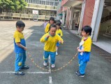 103 playing with the rubber band rope (111)